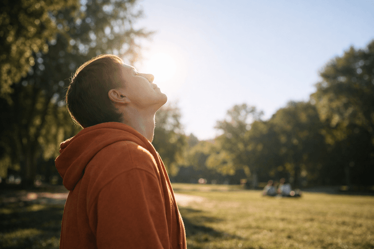 A person enjoying sunlight outdoors promoting Vitamin D intake.